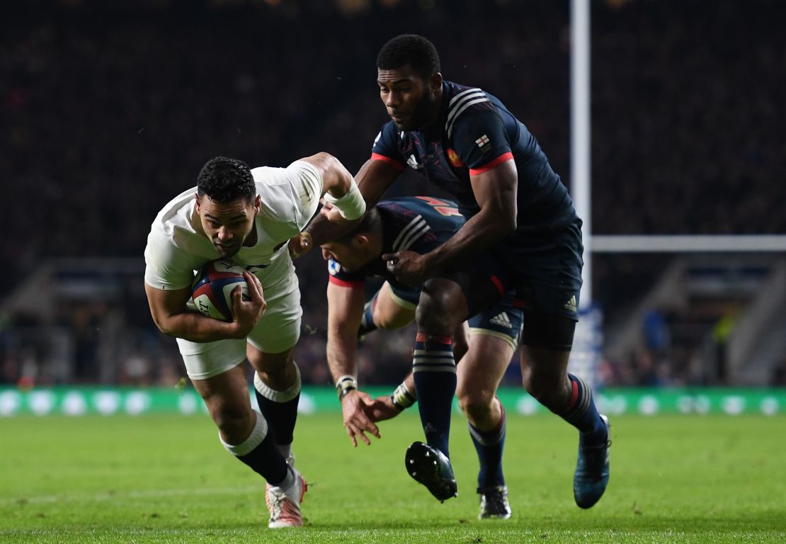  Ben Te'o of England dives to score his side's first try.