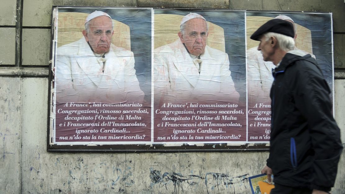 Posters criticizing Pope Francis on a wall in Rome, Italy, February 4, 2017. The poster reads, "You've put congregations under supervision, removed priests, decapitated the Maltese and Franciscan orders and ignored cardinals... But where is your compassion?"  