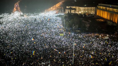 Protesters in Bucharest, Romania, turn on their cell phone lights en masse Sunday night.
