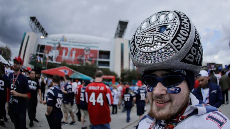 A Patriots fan wears a hat that looks like a giant Super Bowl ring. <a  target="_blank">See all of the Super Bowl rings</a>