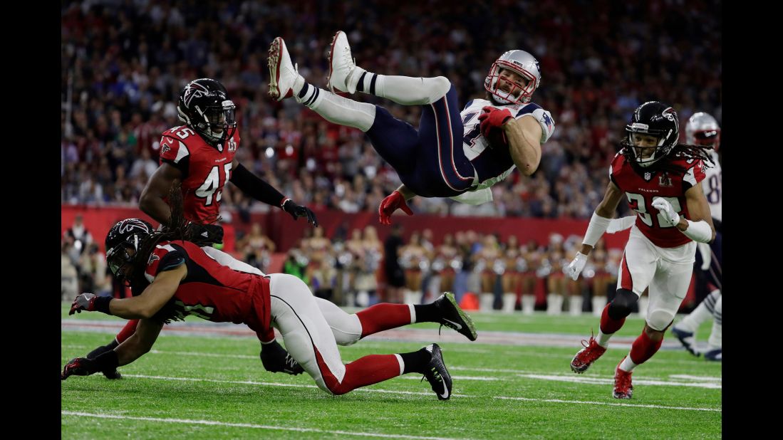 Edelman is upended by Atlanta's Philip Wheeler in the first quarter.