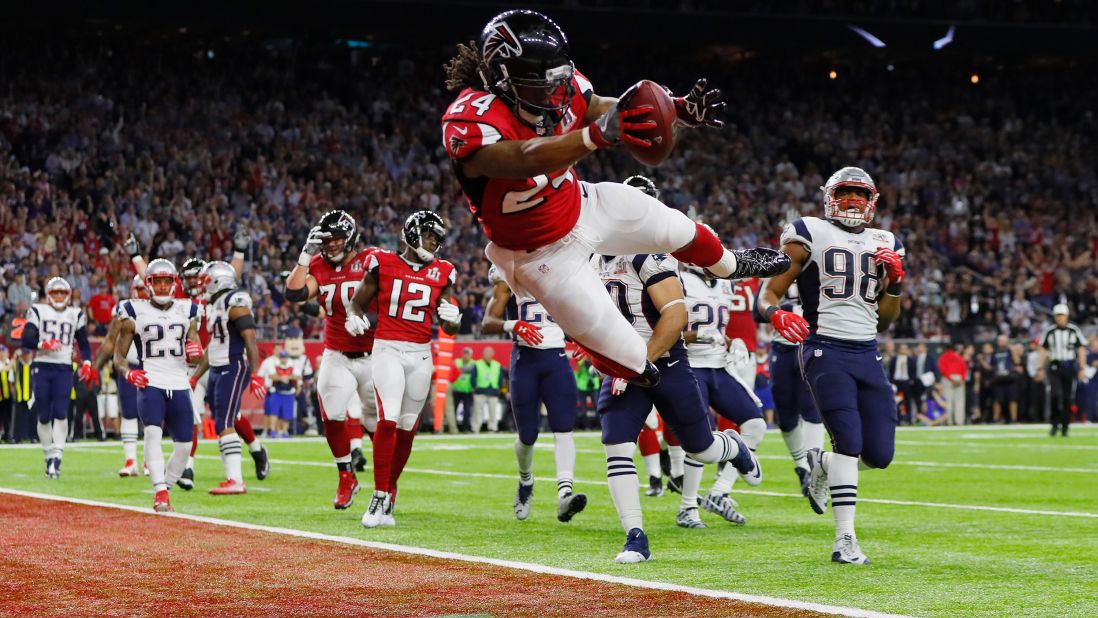 Atlanta running back Devonta Freeman scores the game's first touchdown on a 5-yard run.