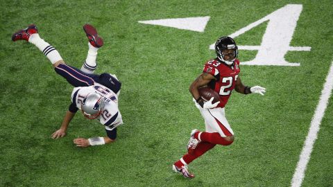 Brady tries to tackle Atlanta's Robert Alford, who intercepted Brady and ran it back for an 82-yard touchdown in the second quarter. Alford's score gave the Falcons a 20-0 lead. They led 21-3 at the half.