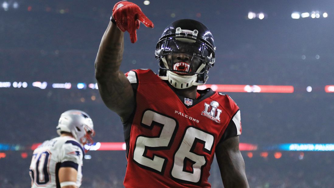 After scoring on a 6-yard touchdown pass in the third quarter, Falcons running back Tevin Coleman celebrates by making an A for Atlanta.