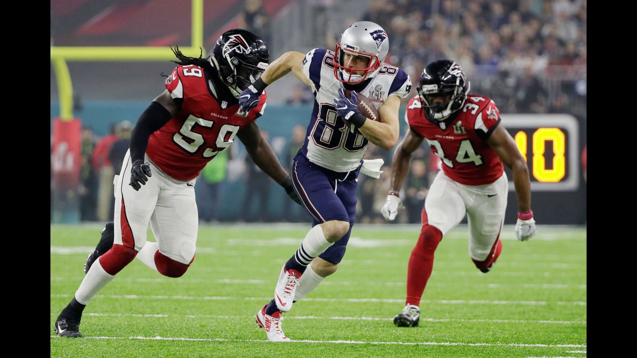 Amendola tries to run past Campbell.