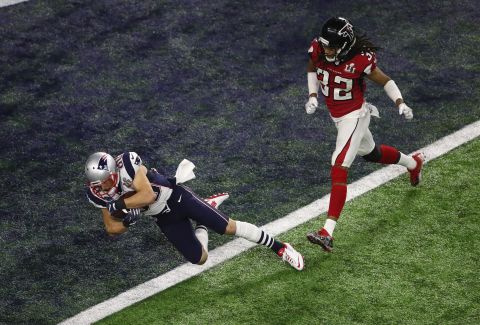 Danny Amendola catches a 6-yard touchdown pass for New England in the fourth quarter. After a two-point conversion, the Patriots cut the Falcons' lead to 28-20 with just under six minutes remaining.