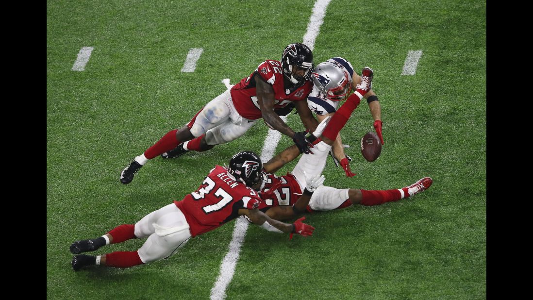 As he fell to the ground, Edelman appeared to cradle the ball near Alford's left leg.
