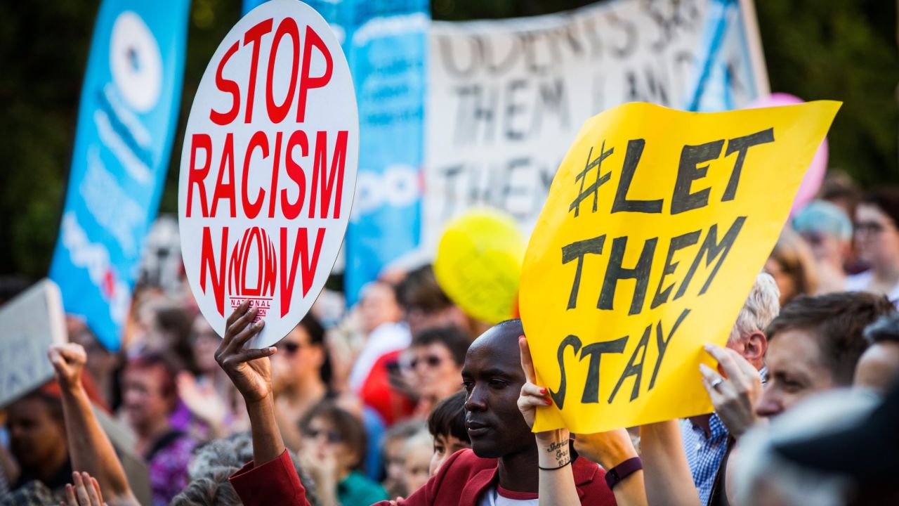 MELBOURNE, AUSTRALIA - FEBRUARY 08:  Thousands of Melbournians rallied on the steps of the state library in co-ordinated, Australia-wide rallies, protesting the High Courts decision regarding the 267 refugees facing deportation on February 8, 2016 in Melbourne, Australia. The High Court rejected a legal challenge to the federal government's offshore immigration detention regime on Wednesday, which means 267 people, including babies and children, face deportation from Australia to detention camps on Manus Island and Nauru within days.  (Photo by Chris Hopkins/Getty Images)