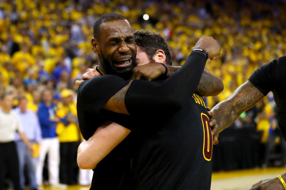 LeBron James (left) and Kevin Love celebrate after winning the 2016 NBA title.