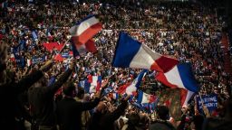 Supporters wave flags as they attend a rally of the French far-right National Front (FN) party presidential candidate to kick off her campaign in Lyon on February 5, 2017.  / AFP / JEFF PACHOUD        (Photo credit should read JEFF PACHOUD/AFP/Getty Images)