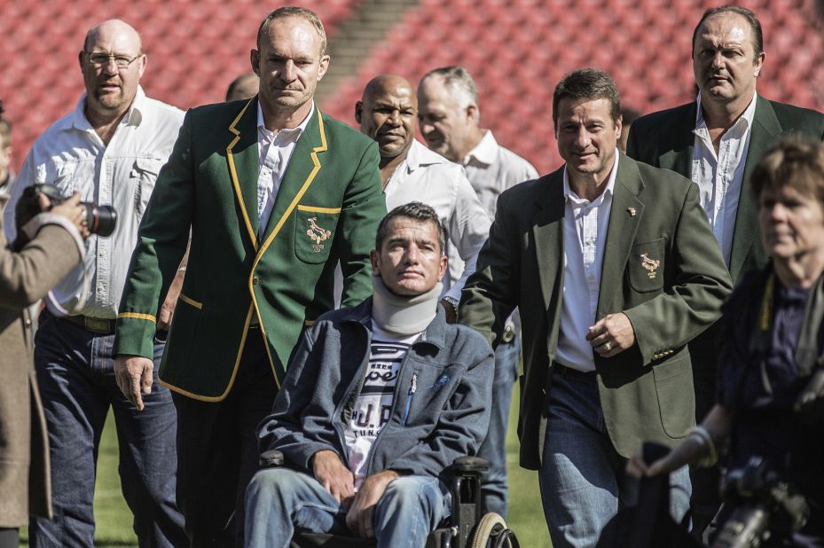 After being diagnosed with motor neurone disease in 2011, van der Westhuizen was bound to a wheelchair for the final years of his life. He is pictured in a re-enactment of the team photo from the World Cup victory at Ellis Park in Johannesburg, South Africa. 