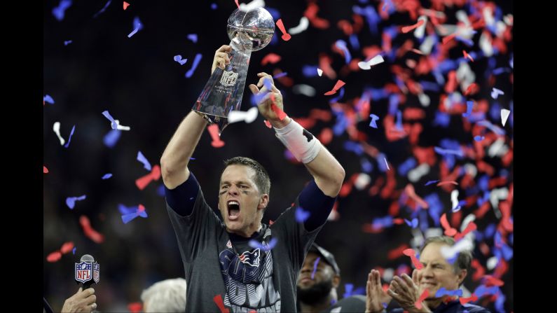New England quarterback Tom Brady raises the Vince Lombardi Trophy after leading the Patriots to a 34-28 victory in <a href="index.php?page=&url=http%3A%2F%2Fwww.cnn.com%2F2017%2F02%2F05%2Fsport%2Fgallery%2Fsuper-bowl-li%2Findex.html" target="_blank">Super Bowl LI</a> on Sunday, February 5. Brady threw for a Super Bowl-record 466 yards as New England completed the biggest comeback in Super Bowl history. The Patriots trailed Atlanta 28-3 in the third quarter but rallied to win in overtime. Brady was named the game's Most Valuable Player.