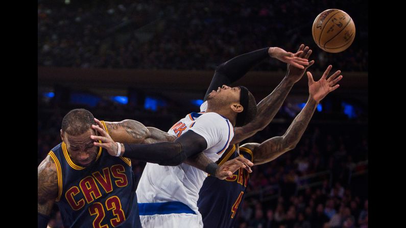 From left, LeBron James, Carmelo Anthony and Iman Shumpert compete for the ball during an NBA basketball game in New York on Saturday, February 4. 