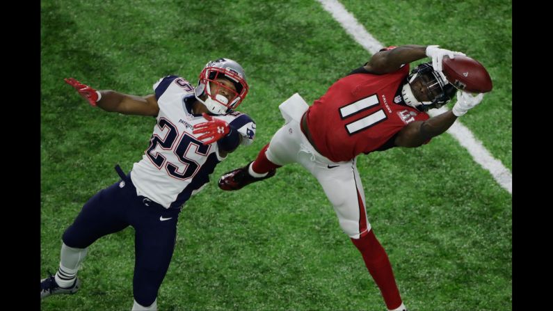 Atlanta wide receiver Julio Jones stretches for a sideline catch in the fourth quarter of Super Bowl LI. It put the Falcons in field-goal position with a chance to maybe put the game out of reach. But a sack and a holding penalty pushed them back toward midfield and they had to punt. <a href="index.php?page=&url=http%3A%2F%2Fwww.cnn.com%2F2017%2F02%2F06%2Fsport%2Fgallery%2Fgreatest-sports-chokes-and-comebacks%2Findex.html" target="_blank">Super Bowl LI: Was it a "choke" or a comeback?</a>