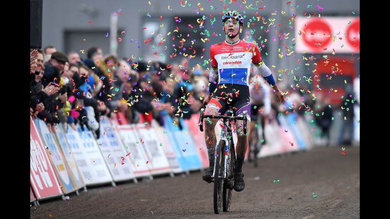 Dutch cyclist Mathieu van der Poel celebrates Sunday, February 5, after winning the seventh stage of the Superprestige cyclocross event in Hoogstraten, Belgium.