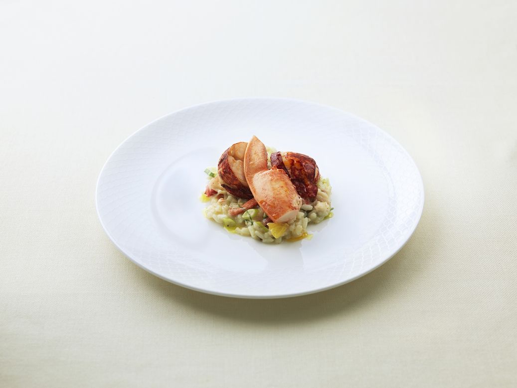 "Order the beautiful lobster risotto featuring carnaroli rice cooked just right, orange segments, scallions, and -- of course -- tender, fiery red lobster."