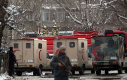 Security forces stand guard at the site of a a suicide attack in Kabul on Tuesday.