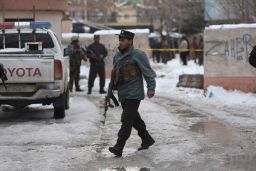 Police inspect the site of the attack Tuesday in Kabul.