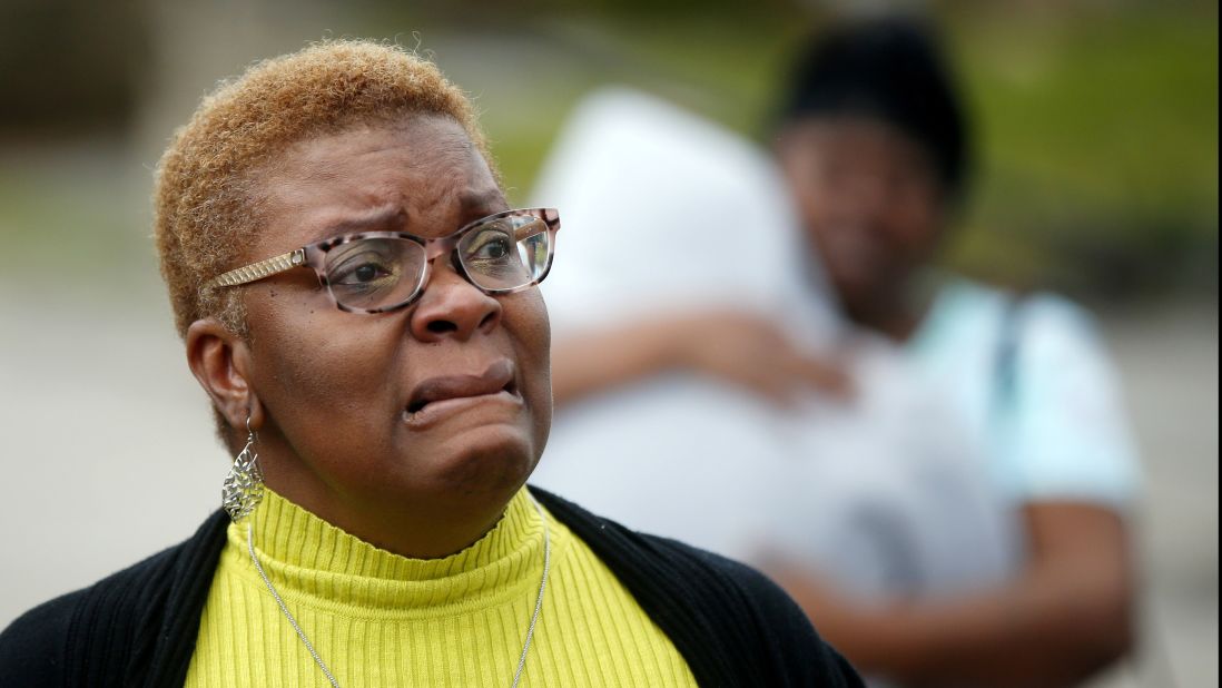 A woman reacts to the damage caused in her neighborhood.