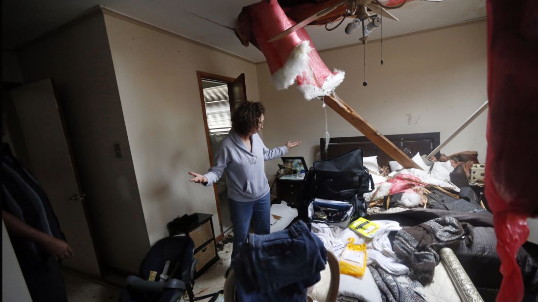 Artie Chaney surveys the damage to her home in New Orleans. The tornado hit while she and her family took cover inside.