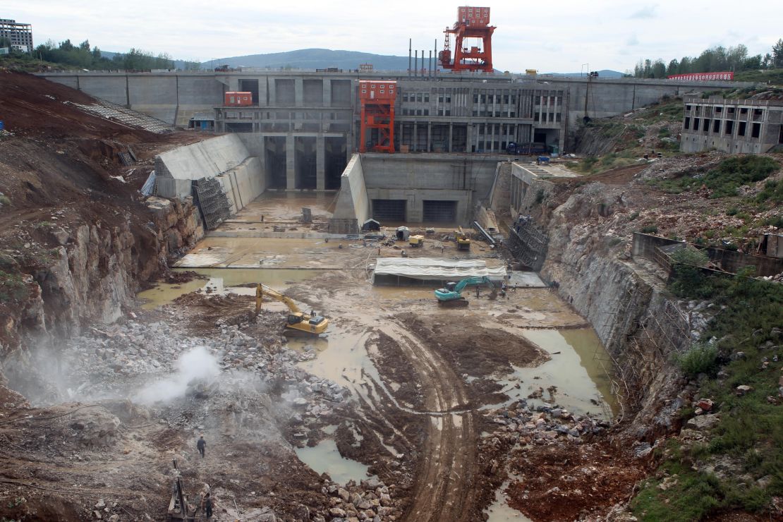 Laborers work on a construction site in September 2013 for the South-to-North Water Diversion plan in central China's Henan province.