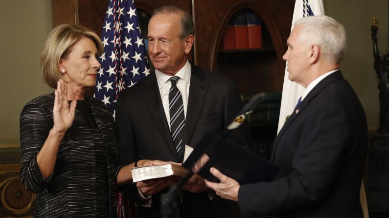 Pence swears in Education Secretary Betsy DeVos next to her husband, Dick, on Tuesday, February 7. Pence <a href="index.php?page=&url=http%3A%2F%2Fwww.cnn.com%2F2017%2F02%2F07%2Fpolitics%2Fbetsy-devos-senate-vote%2F" target="_blank">cast a historic tie-breaking vote</a> to confirm DeVos after the Senate was divided 50-50.