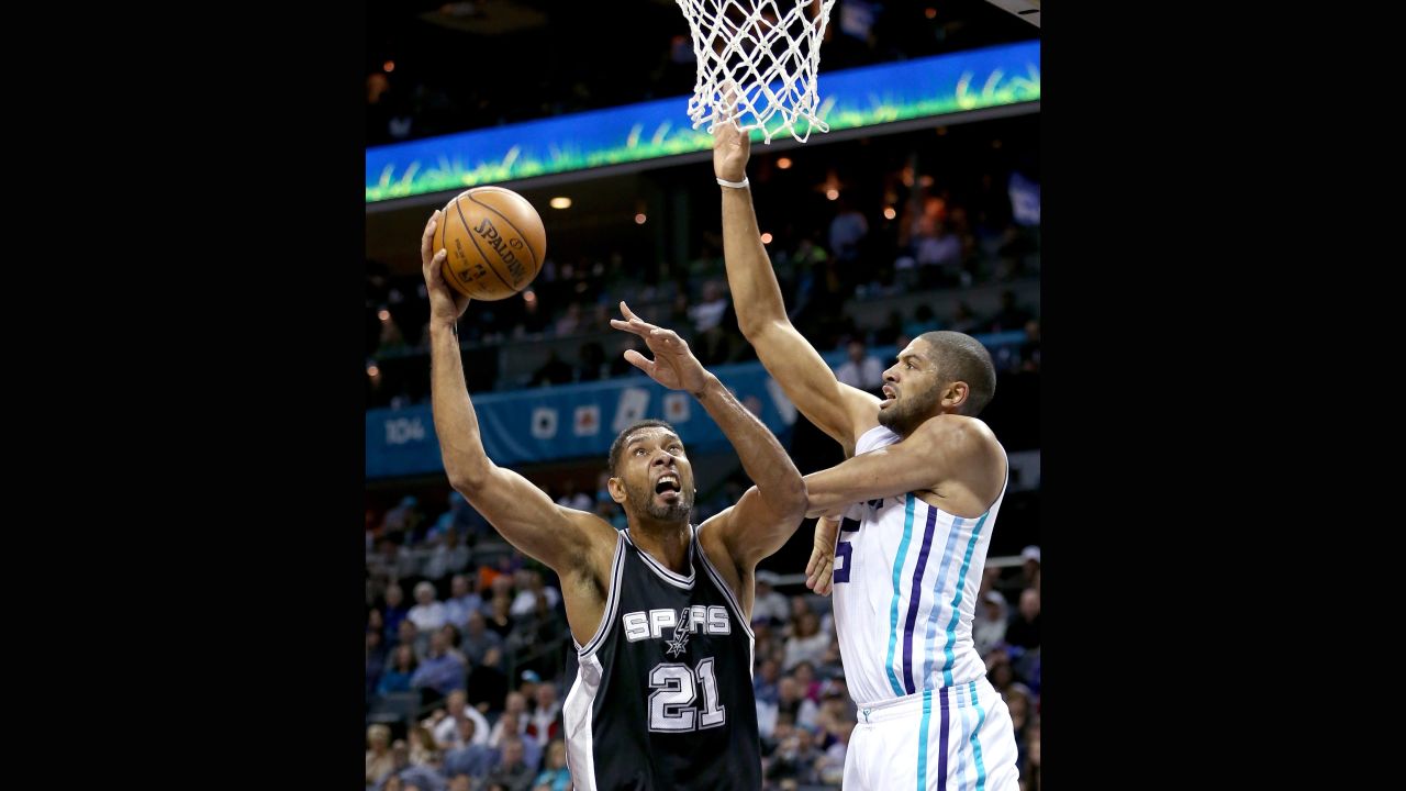 At 40 years old, San Antonio Spurs player Tim Duncan, left, retired in 2016 with five NBA championships. 