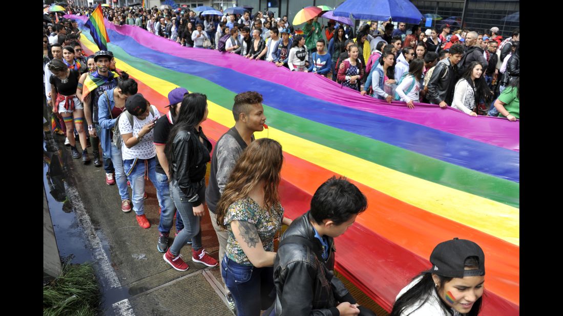 Revelers take part in the pride parade in Bogota, Colombia, on July 3, 2016. Same-sex couples were granted the right to marry in Colombia in early 2016. Members of the LGBT community can also serve openly in the military. 