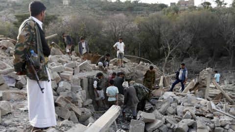 Yemenis search under the rubble of damaged houses following a reported Saudi-led coalition strike in Sanaa on February 1.
