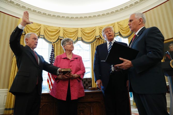 Trump watches as Pence administers the oath of office to Attorney General Jeff Sessions in the White House Oval Office on Thursday, February 9. Sessions, one of Trump's closest advisers and his earliest supporter in the Senate, was confirmed <a href="index.php?page=&url=http%3A%2F%2Fwww.cnn.com%2F2017%2F02%2F08%2Fpolitics%2Fjeff-sessions-vote-senate-slog%2F" target="_blank">by a 52-47 vote</a> that was mostly along party lines. He was accompanied to the swearing-in by his wife, Mary.