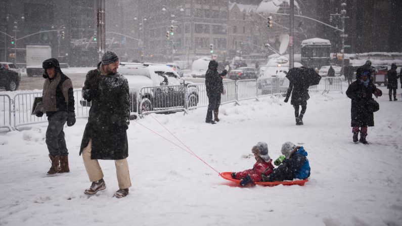 Andrea De Donno pulls a sled carrying his children after they played in New York's Central Park on February 9.