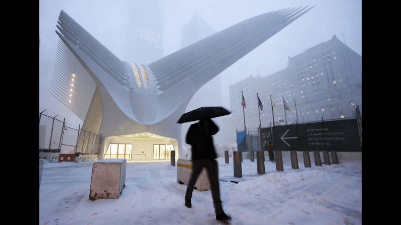 A man in New York walks past the Oculus of the World Trade Center Transportation Hub.