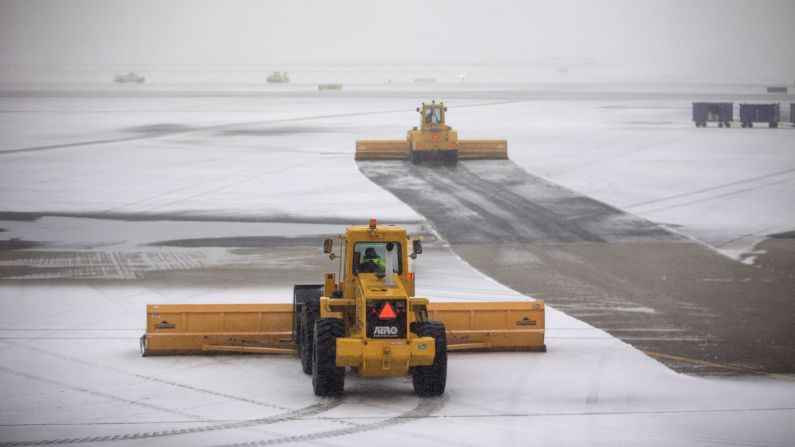 Crews plow snow at Boston's Logan International Airport.