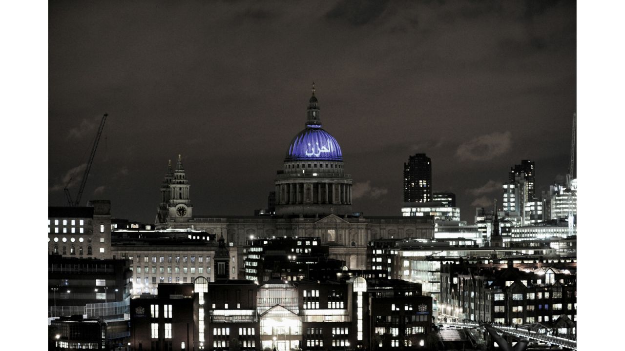 British artist Martin Firrell projected a number of simple words -- including the Arabic word for "sorrow," seen here -- onto St. Paul's Cathedral in London. Inside the cathedral, he projected comments submitted online. 