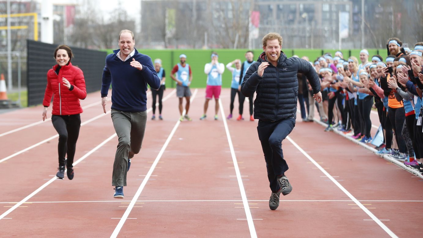 Britain's Prince Harry, right, leads his brother, William, and his sister-in-law, Kate, during a relay race in London promoting the Heads Together charity on Sunday, February 5.