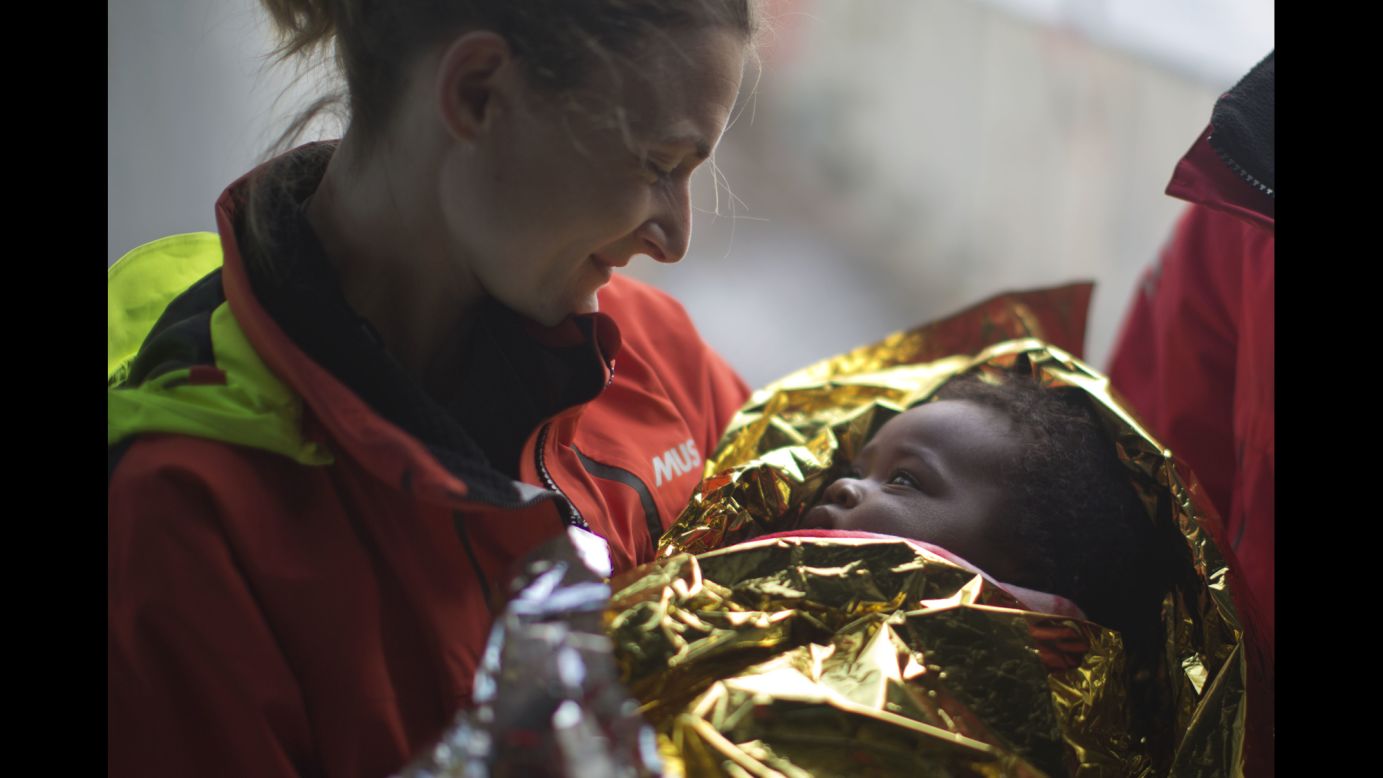 Volunteer Laura Rasero holds Ivorian migrant Oulai Esther after a Spanish group rescued a rubber boat sailing out of control in the Mediterranean Sea on Friday, February 3. <a href="http://www.cnn.com/2015/09/03/world/gallery/europes-refugee-crisis/index.html" target="_blank">Europe's migration crisis in 25 photos</a>