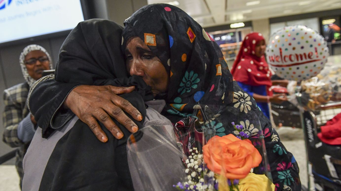 Zahro Warsma, right, hugs her daughter Roodo Abdinasir after Abdinasir flew into Dulles, Virginia, from Somalia on Monday, February 6. Warsma's three daughters and grandchild were caught up in last week's travel ban before a federal judge <a href="http://www.cnn.com/2017/02/03/politics/federal-judge-temporarily-halts-trump-travel-ban-nationwide-ag-says/index.html" target="_blank">temporarily blocked its enforcement. </a>