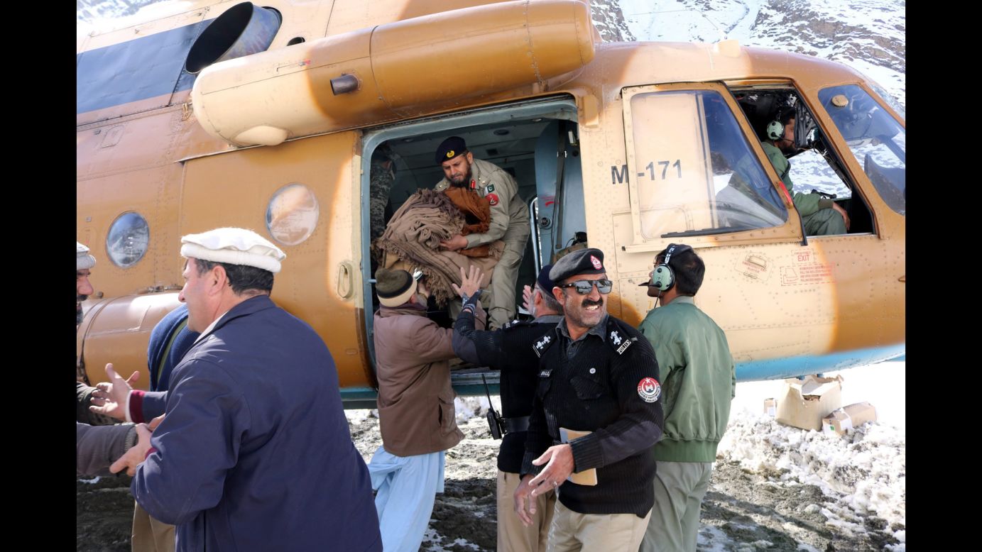 Relief goods are distributed after an avalanche in Chitral, Pakistan, on Monday, February 6. At least 156 people have died along the Afghan-Pakistani border after three days of heavy snowfall <a href="http://www.cnn.com/2017/02/06/asia/avalanche-afghanistan-pakistan/" target="_blank">caused a series of deadly avalanches.</a>