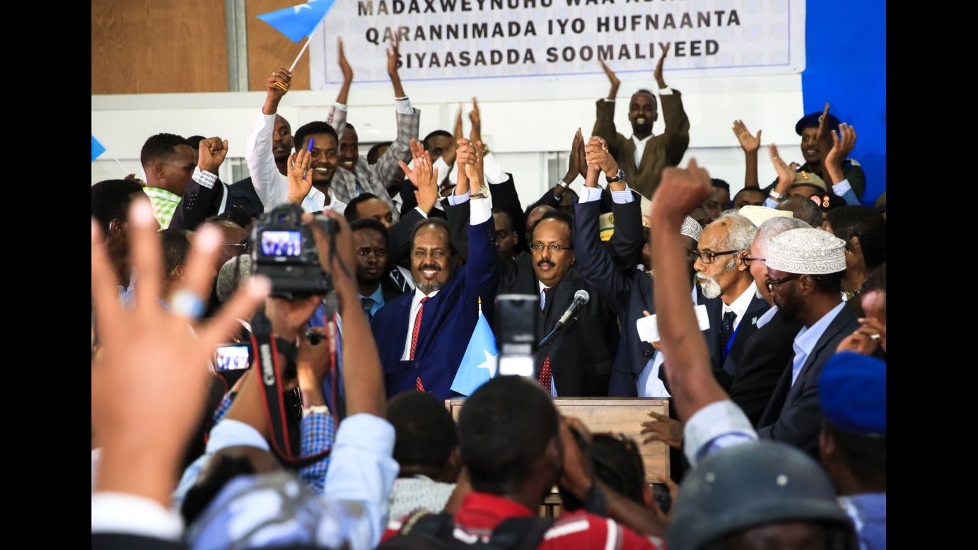 Somalia's new president, Mohamed Abdullahi Farmajo, raises his hands with outgoing President Hassan Sheikh Mohamud, left, in Mogadishu, Somalia, on Wednesday, February 8. The country's parliament elected Farmajo, a dual US-Somali citizen, <a href="http://www.cnn.com/2017/02/08/africa/mohamed-abdullahi-farmajo-somalia-election/" target="_blank">after Mohamud dropped out of the contest</a> after the second round of voting.