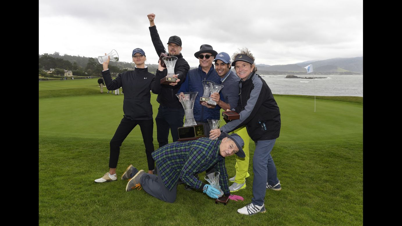 Actor Bill Murray, bottom, poses with other members of his golf team after they won a celebrity tournament in Pebble Beach, California, on Wednesday, February 8. From left are Kelly Rohrbach, Josh Duhamel, Andy Garcia, Kunal Nayyar and Gary Mule Deer.