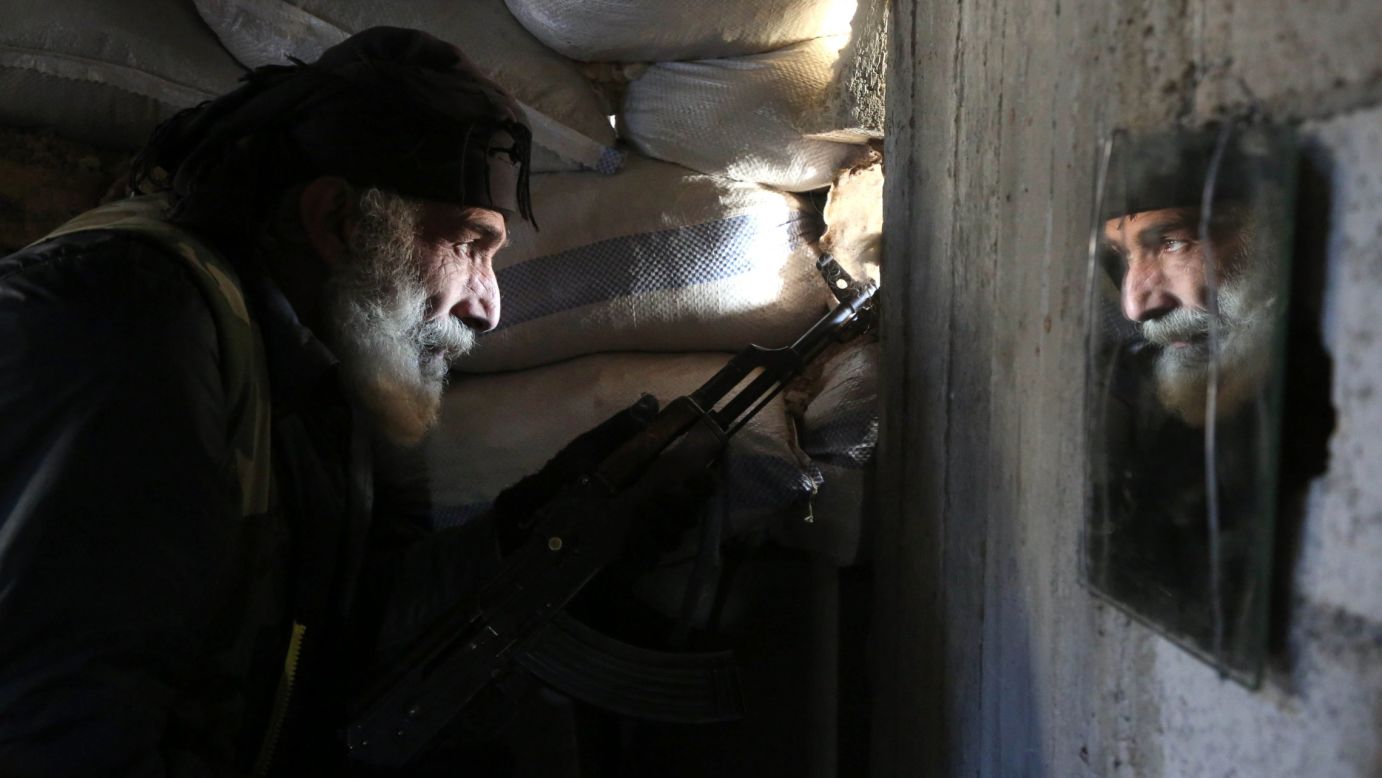 Mahmoud Al-Khatib, a Syrian rebel fighter, holds a position in Al-Bilaliyah, Syria, on Saturday, February 4.