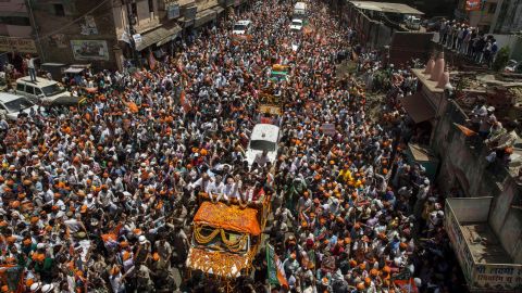 BJP leader Narendra Modi waves to supporters in Varanasi from an open truck in April 2014.