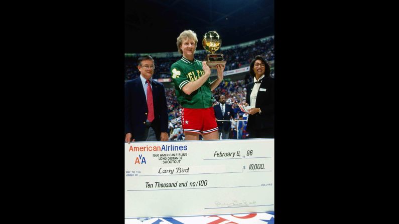 <strong>First champion:</strong> Bird receives his trophy and a check for $10,000 after winning the contest in 1986. The Boston Celtics great also won in 1997 and 1998.