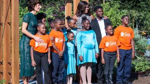 Next to the White House Kitchen Garden on the South Lawn in Washington, DC, USA, on October 18, 2016., (l-r), Mrs. Agnese Landini, and First Lady Michelle Obama, pose for a group photo with students who performed from a local Turnaround Arts school program, as part of the spousal program for the Italy Official Visit.