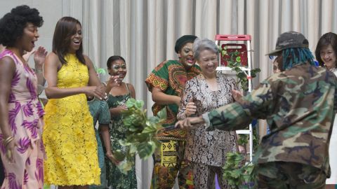 First Lady Michelle Obama and Ho Ching(L), wife of Singapore's Prime Minister Lee Hsien Loong watch a performance by students at the Turnaround Arts Summer Program at the National Gallery of Art in Washington DC, August 2, 2016.