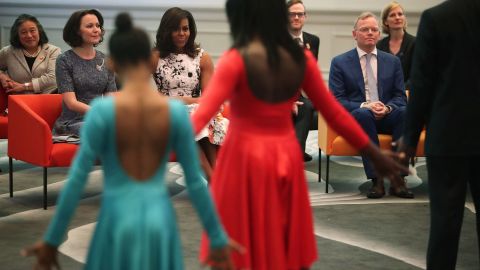 U.S. first lady Michelle Obama (3rd L); Jenni Haukio (2nd L), spouse of the President of Finland; and Sindre Finnes (2nd R), spouse of the Prime Minister of Norway, watch a dance performance during a visit at the Renwick Gallery May 13, 2016 in Washington, DC. 