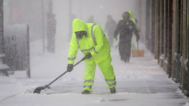 Workers clean the sidewalk on Boston's Boylston Street on February 9.