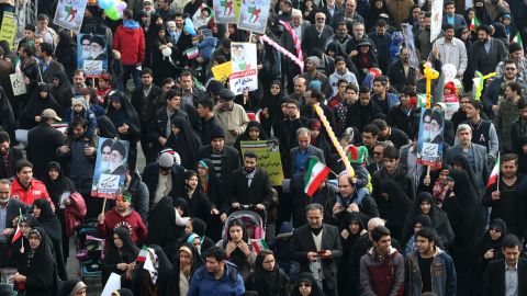 Iranians march on Friday.