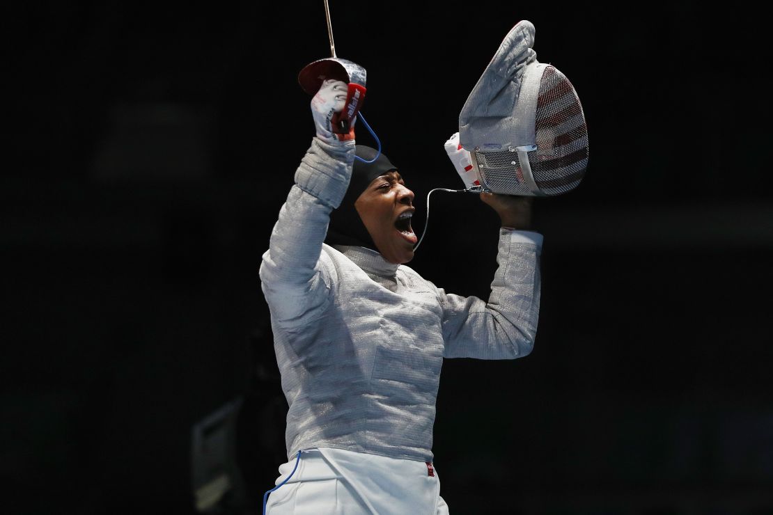 Ibtihaj Muhammad celebrates victory over Olena Kravatska of Ukraine during on Day 3 of the Rio 2016 Olympics.