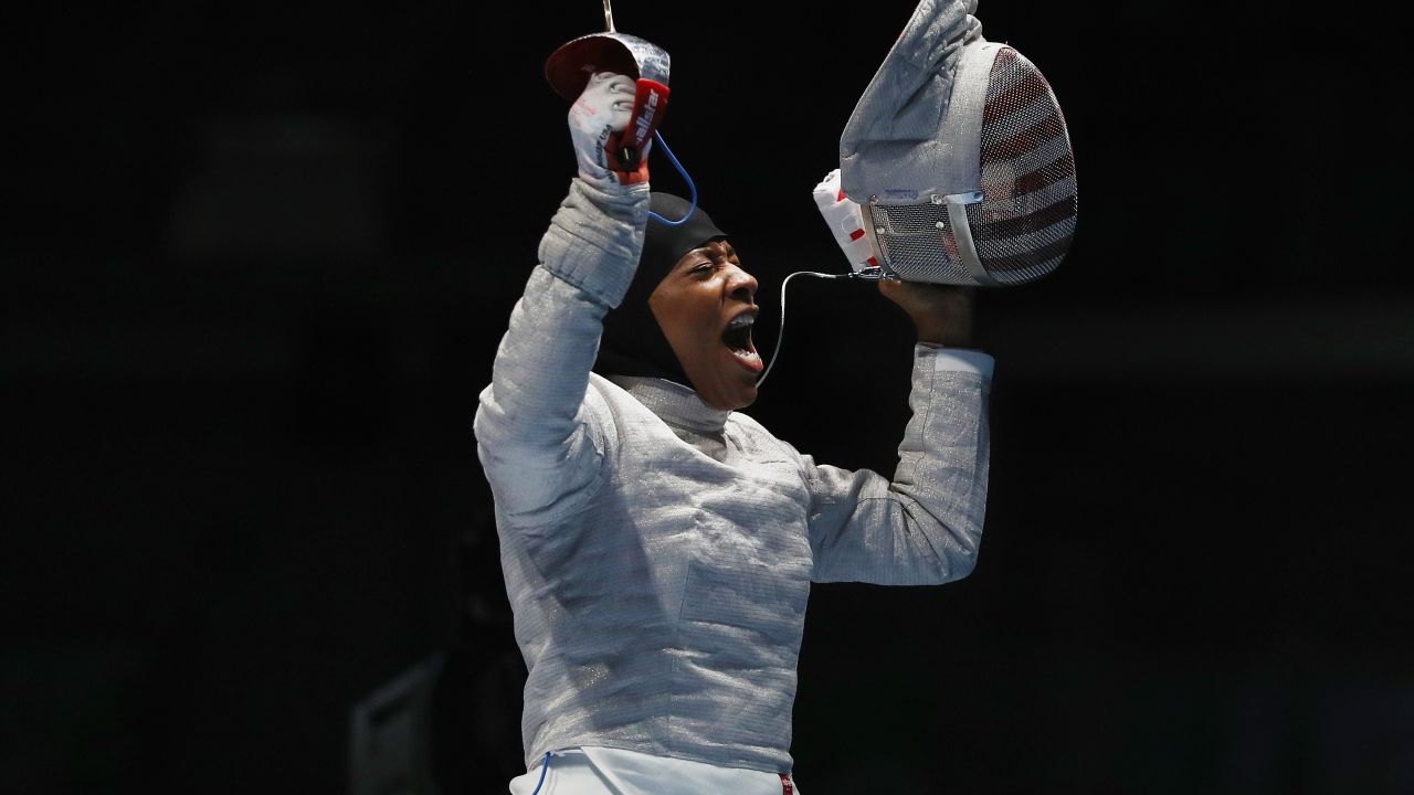 Ibtihaj Muhammad celebrates victory over Olena Kravatska of Ukraine during on Day 3 of the Rio 2016 Olympics.